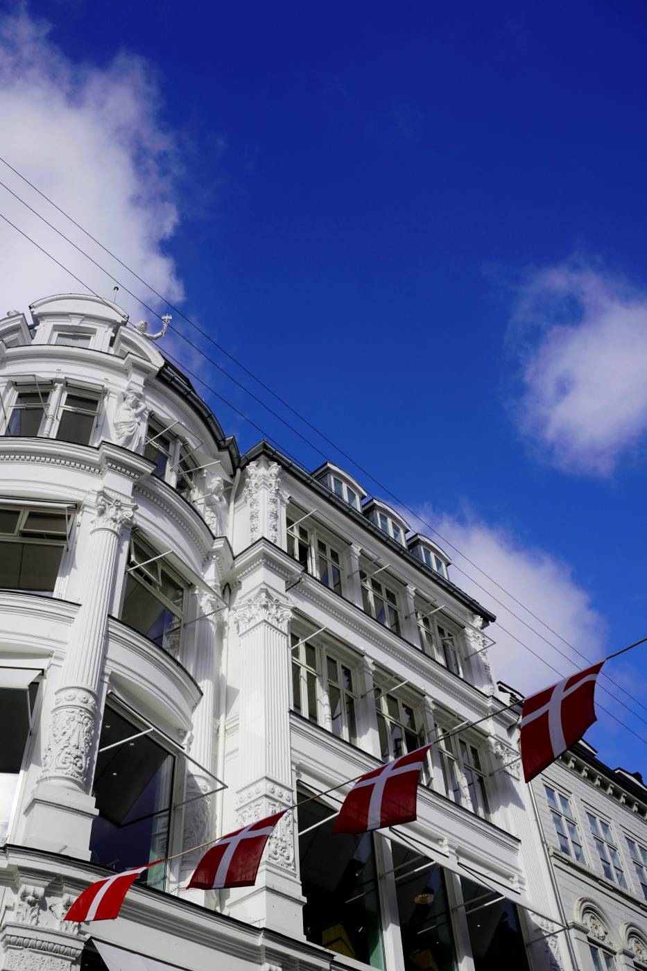 black aesthetic A white building with red and white flags on it black picture