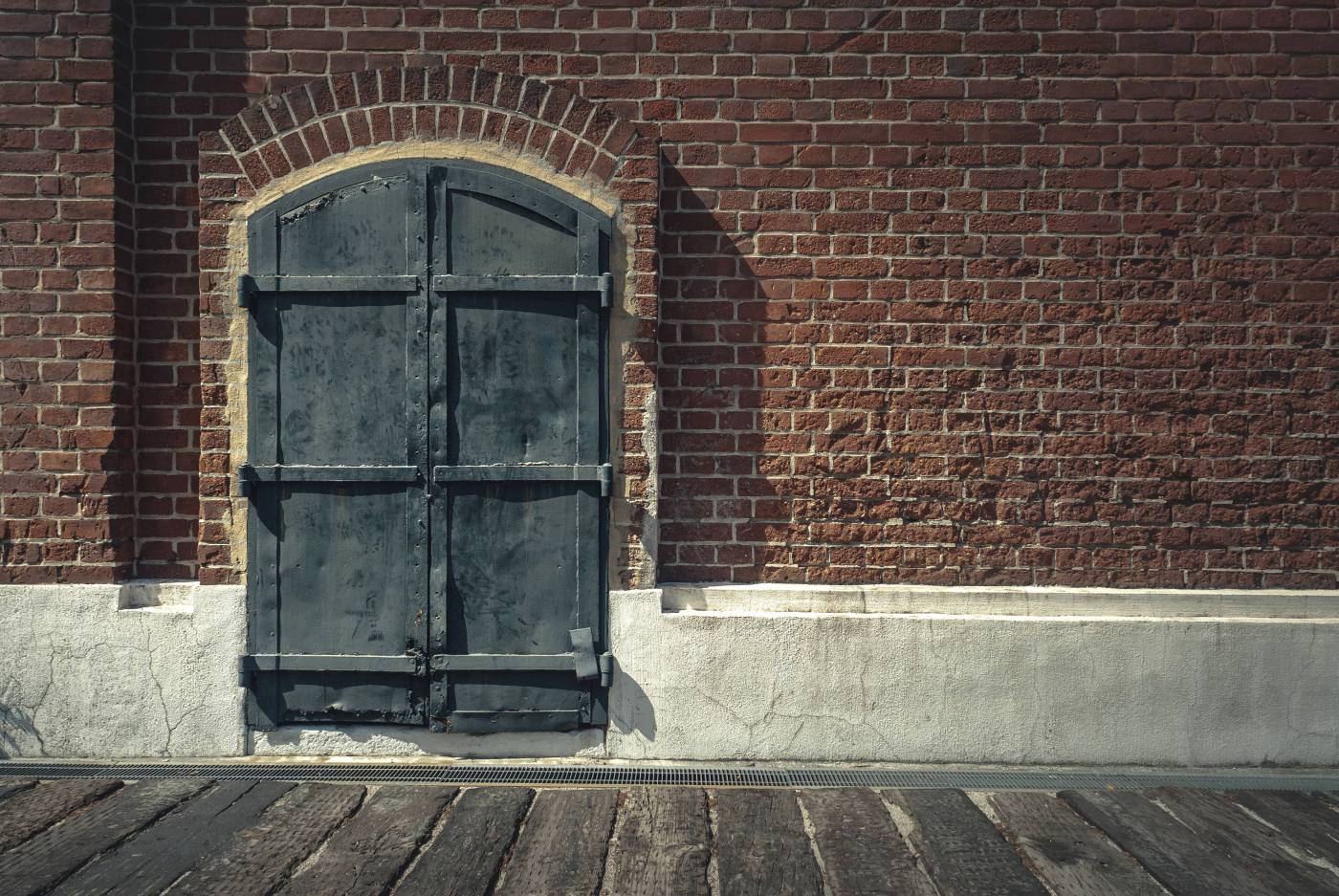  black wooden door on brown brick wall  picture