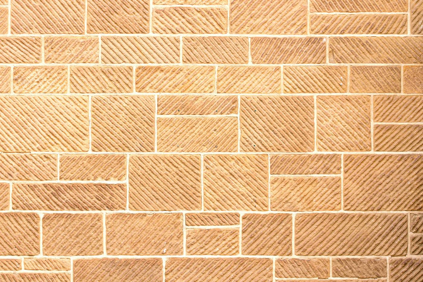  brown brick wall during daytime  picture
