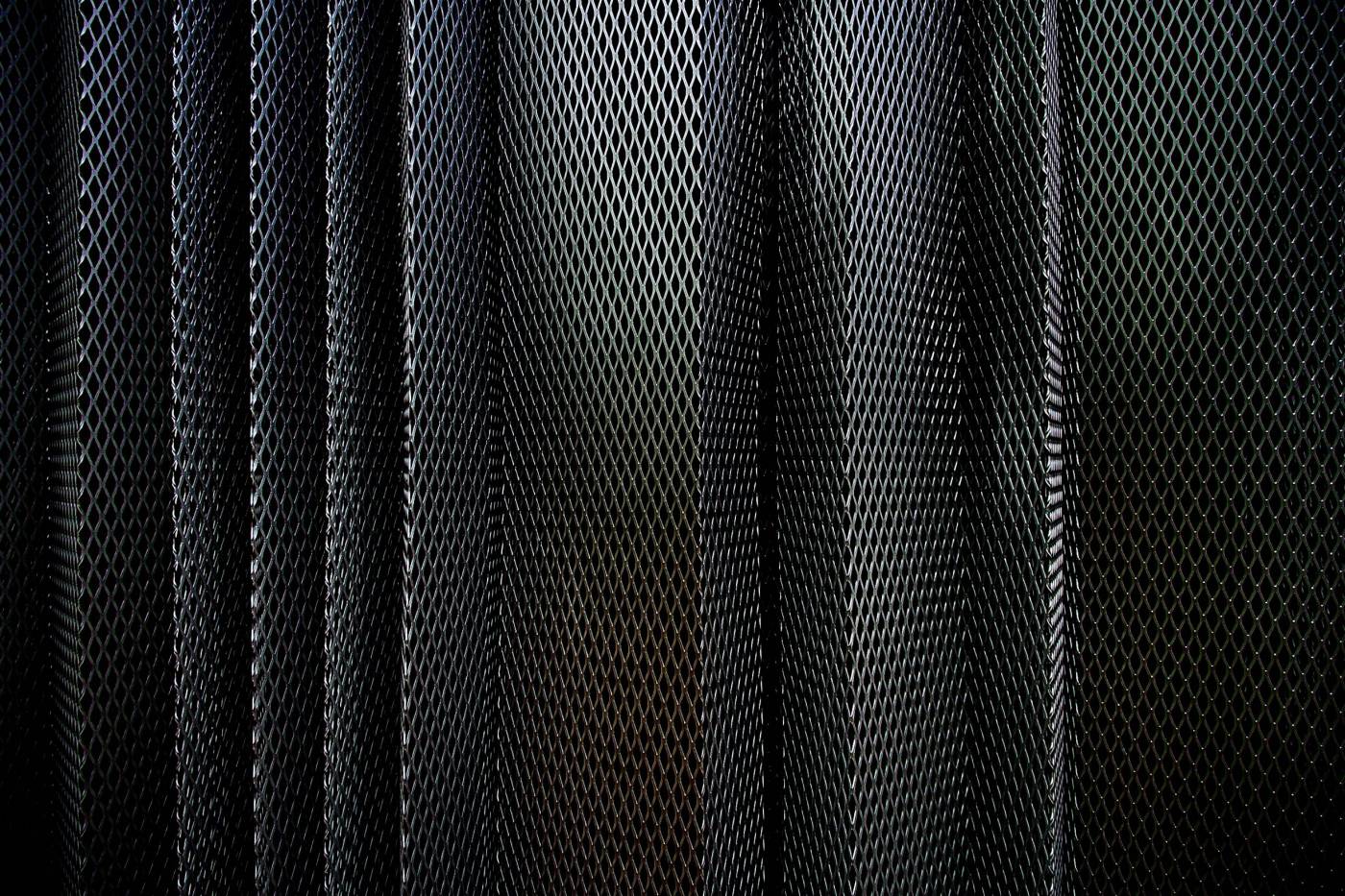 pattern A metal criss-cross grid in undulating layers  picture