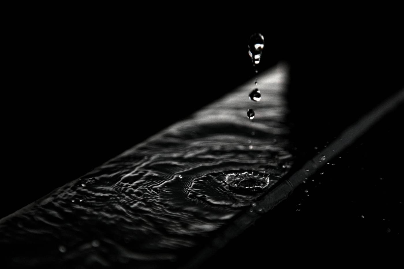  water droplets on black surface  picture