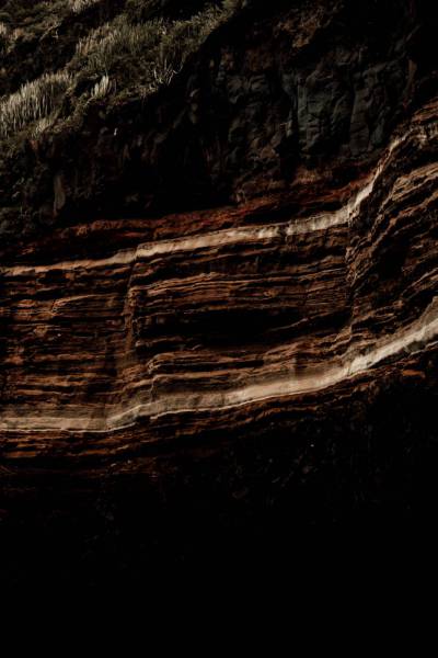 pattern brown rock formation during daytime tenerife
