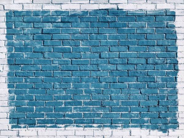 background gray concrete bricks painted in blue blue