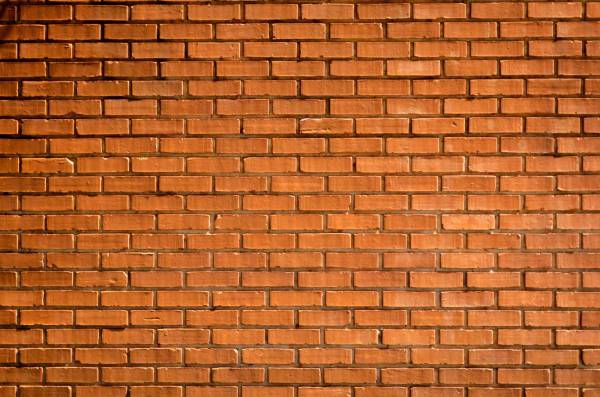 brown closeup photography of brown brick wall wall