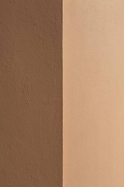 brown white wall paint beside white wall 