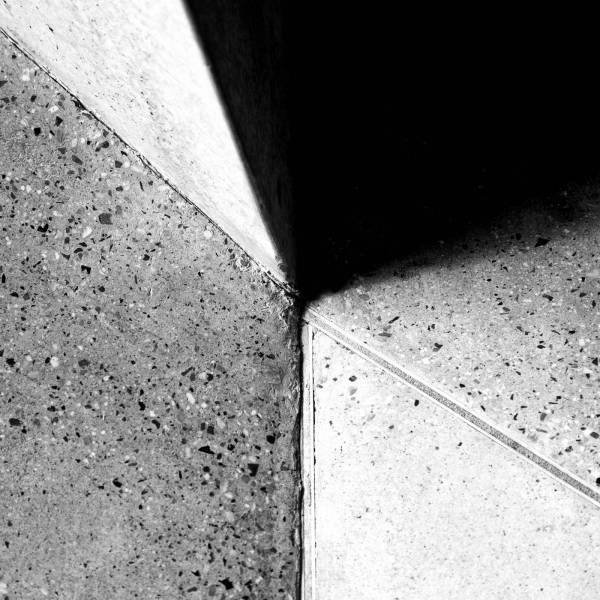 concrete grayscale photo of concrete floor pattern
