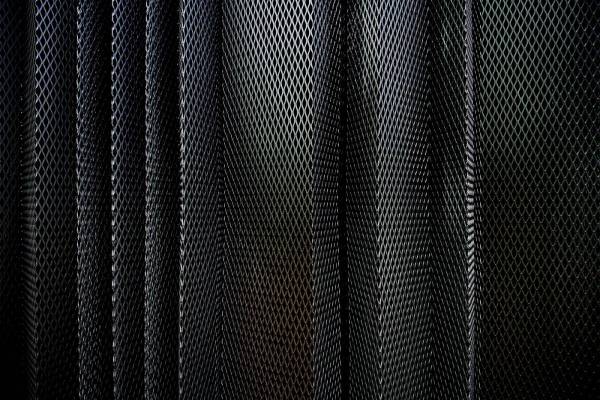 pattern A metal criss-cross grid in undulating layers 