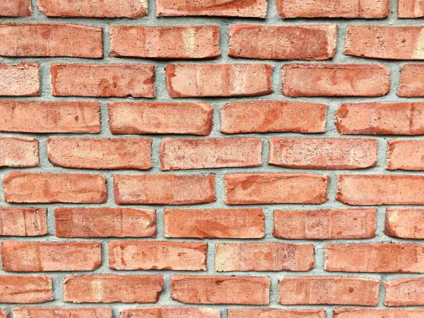 pattern red brick wall during daytime brick