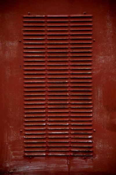  red metal tool box on red surface 